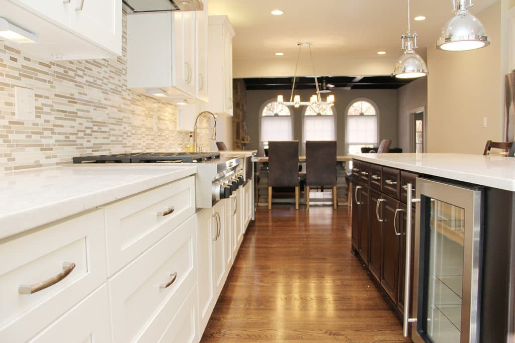 White Cabinets And Wood Flooring Kitchen