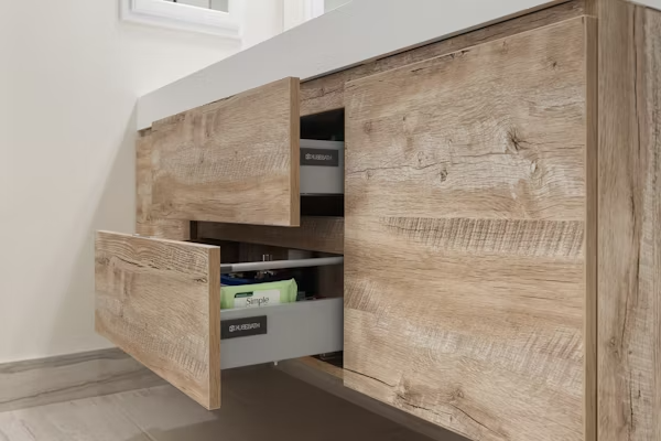 Modern kitchen featuring sleek handle-free kitchen cabinets with push-to-open technology and seamless design.