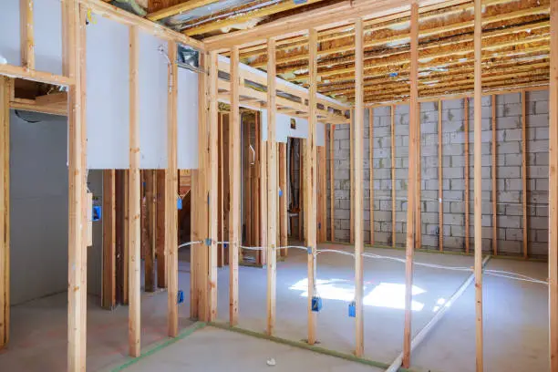 Basement remodeling in progress with construction tools and framing – basement remodeling