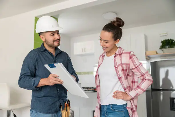 Homeowner comparing bathroom remodel estimates from different contractors