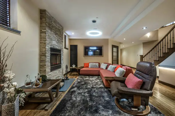 Basement remodeling project with cozy family room and entertainment setup