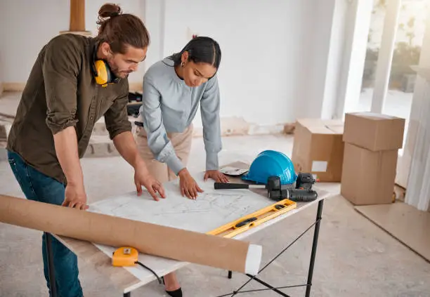 Contractor and homeowner reviewing small bathroom renovation plans – bathroom remodel, small bathroom planning