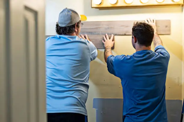 Professional bathroom remodelers working on a renovation project