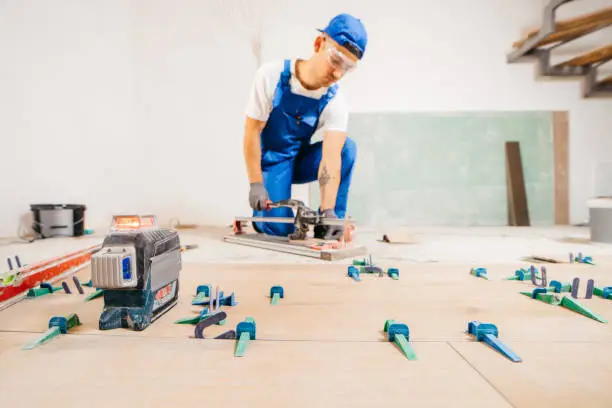 Local bathroom remodel contractor working on tile installation