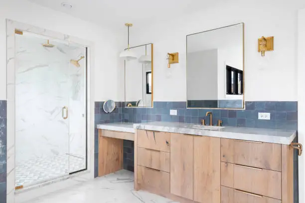 luxury bathroom remodel with marble tile and custom vanity