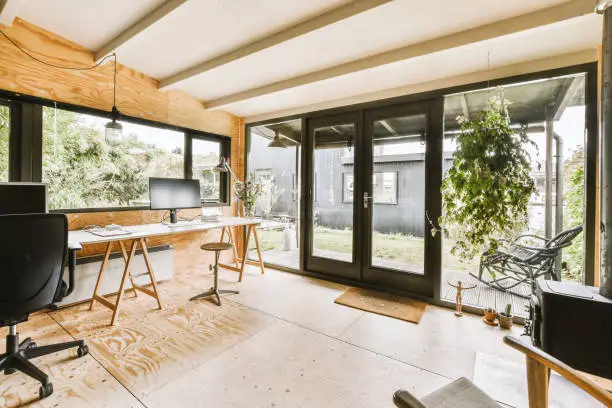 Garage remodeling home office with modern design and natural lighting