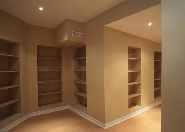 Basement remodeling space-saving storage solutions and built-in shelves