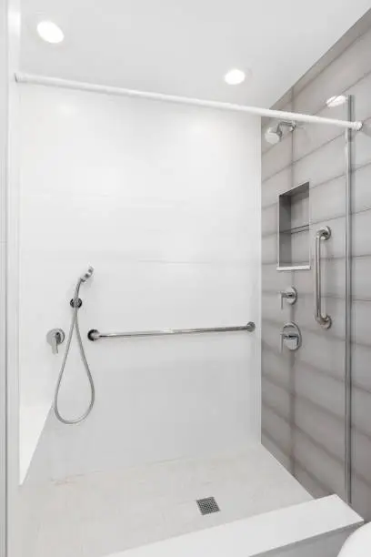 Universal design remodeling bathroom with barrier-free shower and integrated grab bars