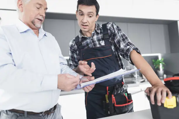 Professional kitchen remodel contractor discussing budget-friendly design plans