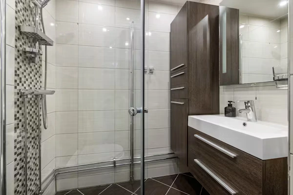 spacious walk-in shower bathroom renovation with multiple showerheads