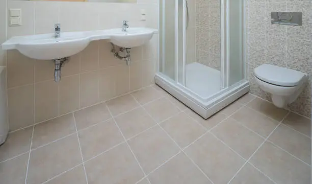 Waterproof bathroom flooring with tile and slip-resistant surface