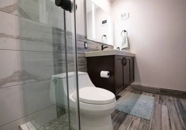compact bathroom remodel with floating vanity and space-saving features