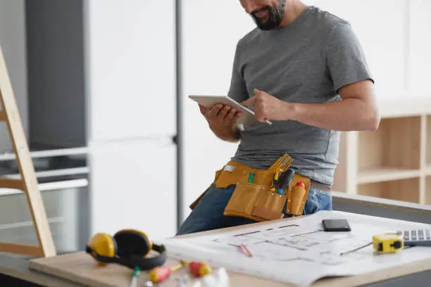 Home remodeling contractor planning smart kitchen and bathroom upgrades