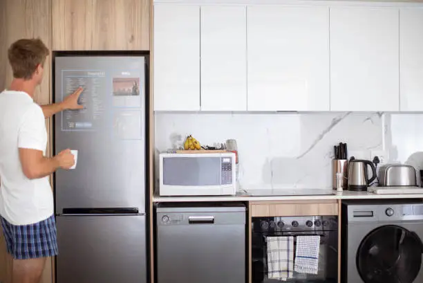 Sensory-friendly kitchen with quiet appliances and touch-sensitive features for neurodiverse individuals.
