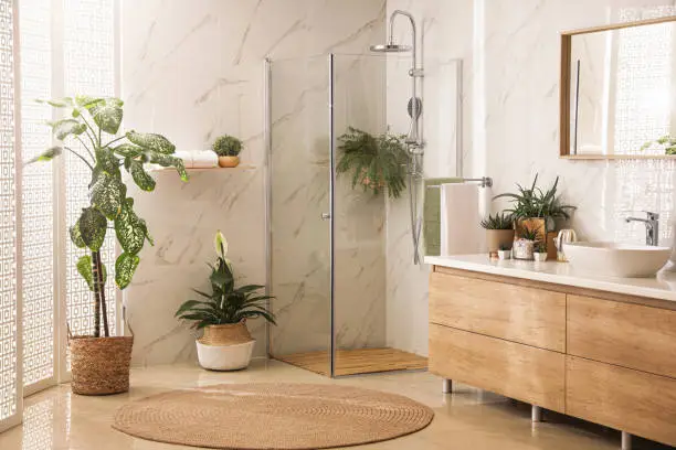 A stylish bathroom with a low-flow showerhead and minimal design that emphasizes sustainability.