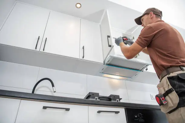 small kitchen remodel with white cabinets and modern finishes