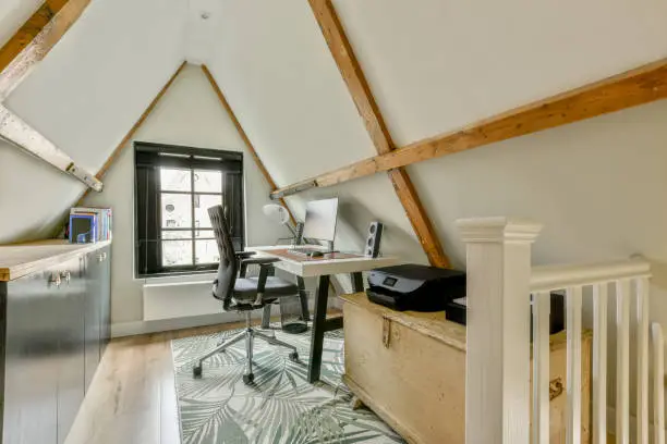 Cozy attic space converted into a quiet workspace – attic and home remodeling trend