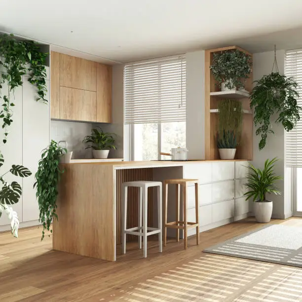 A bright, modern kitchen with large windows, indoor plants, and natural wood finishes showcasing biophilic design principles.