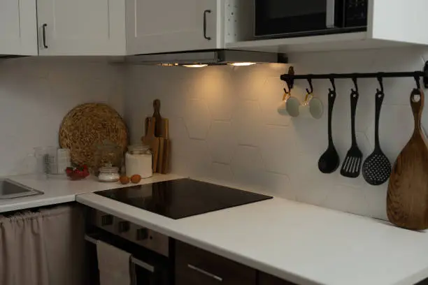 A sensory-friendly kitchen remodel with soft lighting and matte finishes designed for neurodiversity comfort.