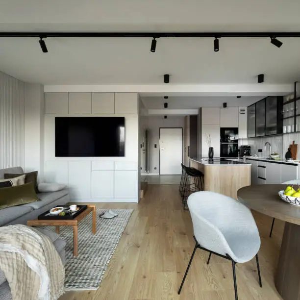 Peaceful open-plan home interior showcasing acoustic-conscious kitchen and bathroom design