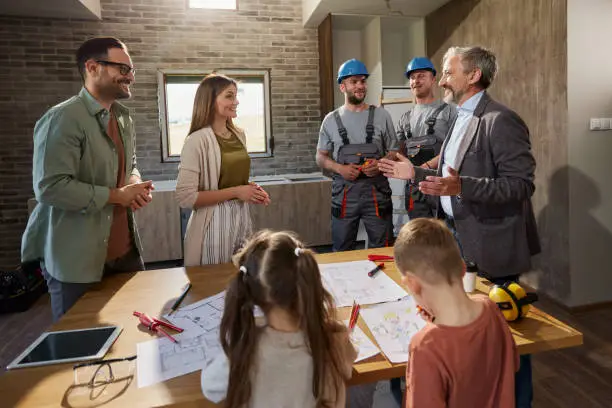 Family meeting with contractor to plan multi-generational remodel