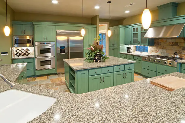 Green kitchen remodel featuring Energy Star appliances and sustainable countertops