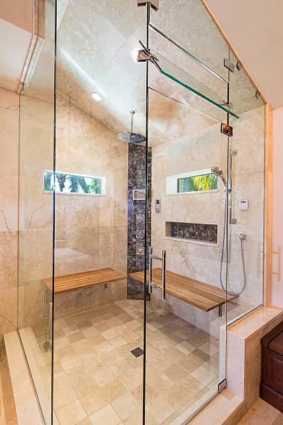 Steam shower with built-in scent diffuser as part of a high-end bathroom remodeling project.