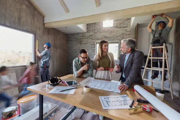 Local kitchen remodel experts discussing project details with homeowner
