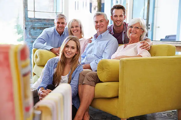 Smiling multi-generational family in remodeled shared living space