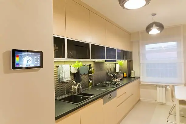 Voice-controlled appliances and smart lighting in a remodeled kitchen