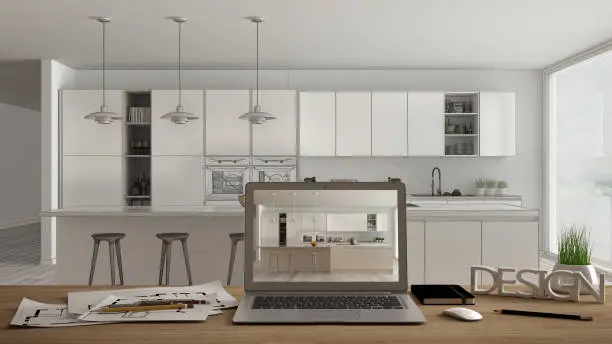 Modern kitchen with a sleek island and laptop, showcasing kitchen and bathroom remodeling