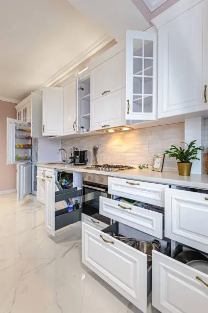 Universal design kitchen with pull-out shelves and touchless faucets, crafted by KBR’s kitchen remodel experts for accessibility.