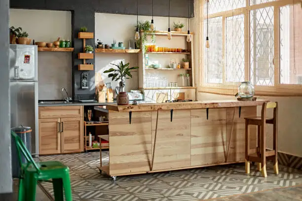 Sustainable kitchen with reclaimed wood cabinets, showcasing KBR Kitchen & Bath’s eco-friendly remodeling expertise.