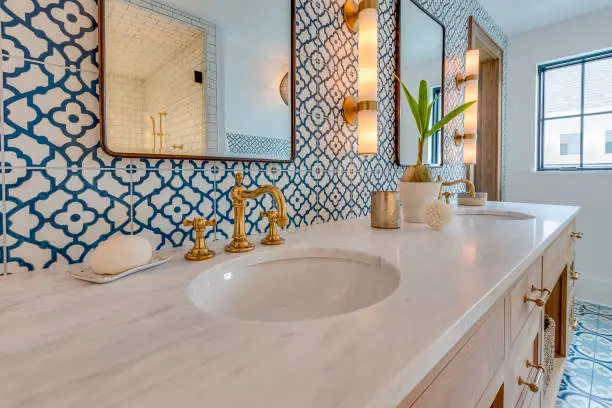 Bathroom with Moroccan blue accents, reflecting KBR’s travel-inspired kitchen and bathroom remodel expertise.