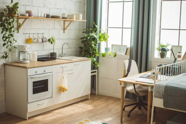 Bright kitchen remodel near me with natural light and organized storage, boosting remote work productivity and wellness by KBR Kitchen & Bath.
