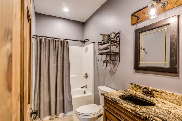 Affordable travel-inspired bathroom with local materials, crafted by KBR’s remodel contractors.