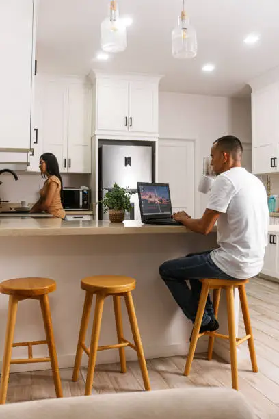 Kitchen remodel near me with breakfast bar and smart appliances, designed for remote work efficiency by KBR Kitchen & Bath.