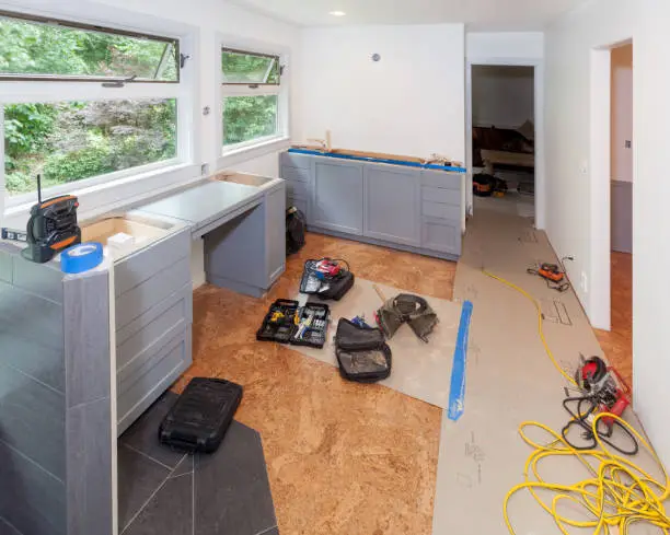 Kitchen remodel contractors use cork flooring for soundproofing in a budget kitchen remodel by KBR.