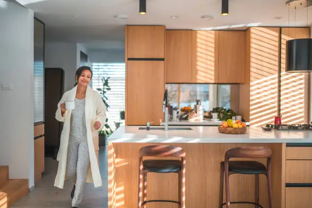 Daily rituals enhanced by KBR’s kitchen and bathroom remodeling, featuring a coffee station and walk-in shower in Fairfax showrooms.