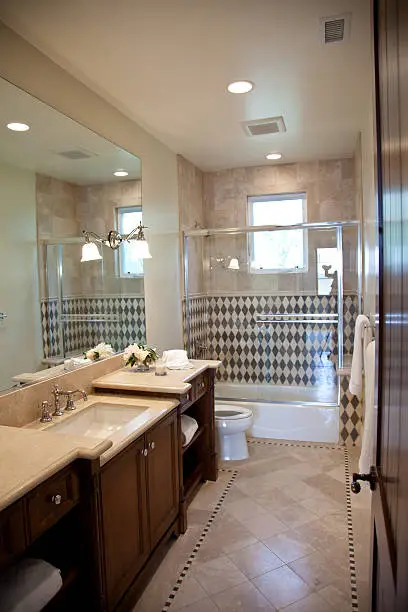 Mediterranean-inspired bathroom with mosaic tiles, crafted by KBR’s remodel contractors for travel-inspired design.
