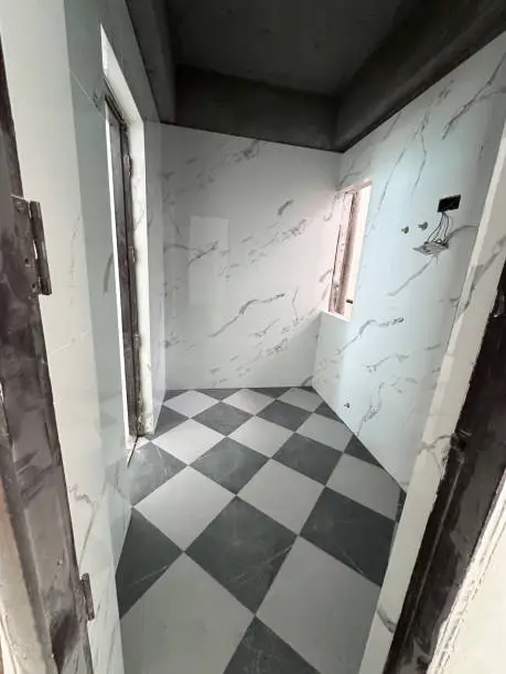 Flood-proof bathroom with porcelain tiles, crafted by KBR Kitchen & Bath’s bathroom remodel contractors.