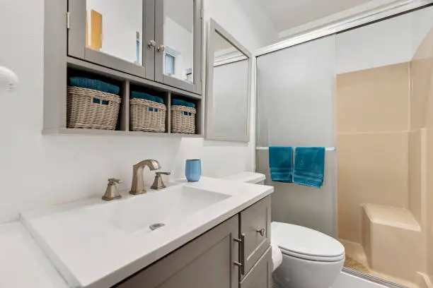 Sustainable bathroom remodel near me with water-saving fixtures and VOC-free materials by KBR Kitchen & Bath.