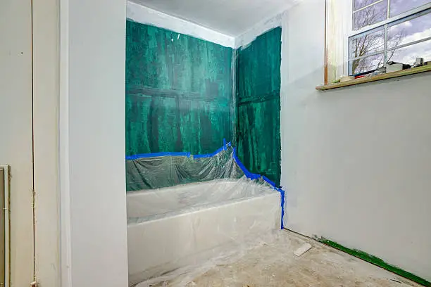 Soundproofing with Green Glue in a small bathroom remodel by KBR Kitchen & Bath’s modern designs.