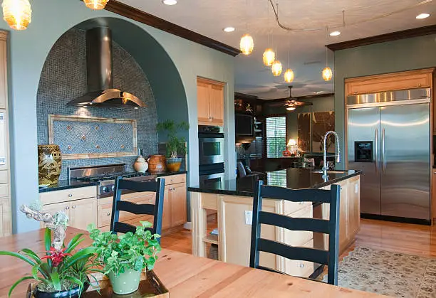 Mediterranean-inspired kitchen remodel by KBR Kitchen & Bath, showcasing travel-inspired kitchen and bathroom remodeling.