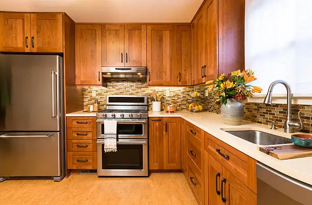 Kitchen with cork flooring and soft-close drawers, crafted by KBR’s remodel contractors for soundproofed kitchen and bathroom remodels.