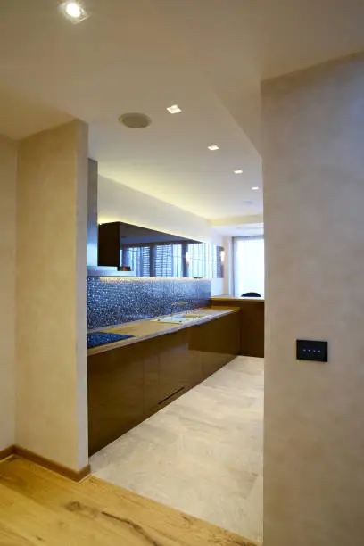 Kitchen with concealed antenna pathways in the ceiling and shielded outlets, showcasing KBR’s radio-centric home design.