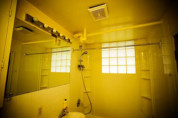 Bathroom with improper fixture placement and ventilation issues.
