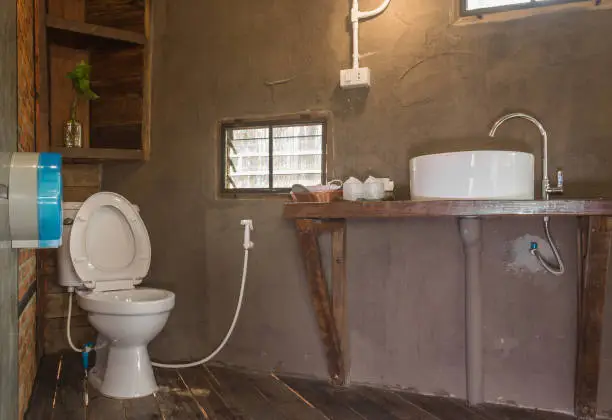 Bathroom with low-flow fixtures and composting toilet.