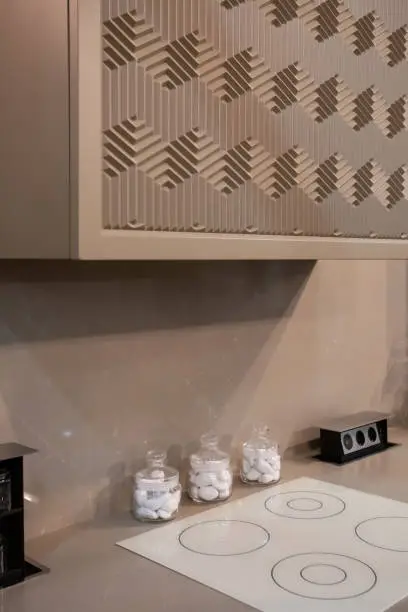 Kitchen with 3D-printed countertops and custom storage inserts.
