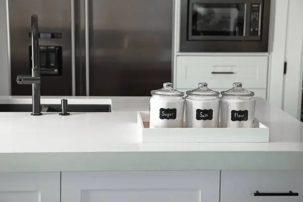 Kitchen with separate prep zones and labeled storage for allergens.